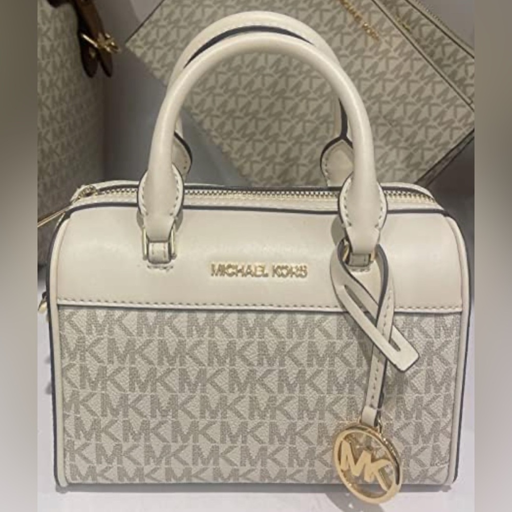 Michael Kors Jet Set Travel Extra Small Duffle Crossbody Bag with AirPod case.